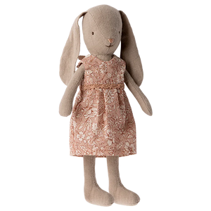 The Maileg Bunny Size 1, Classic - Flower Dress, is a beige stuffed toy bunny crafted from soft natural fabrics and dressed in a charming pink floral dress.