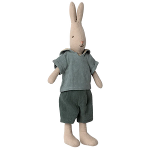 The Maileg Rabbit Size 2, Classic - Shirt and Shorts from the renowned Maileg brand is dressed in a charming green shirt and shorts, adding a delightful touch to the dollhouse collection.