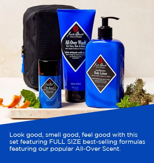 Three blue Jack Black Clean and Cool Body Basics Set products and a black pouch are arranged with leaves, an orange slice, and peppercorns on a table. Text below highlights the set’s best-selling formulas for daily body care.