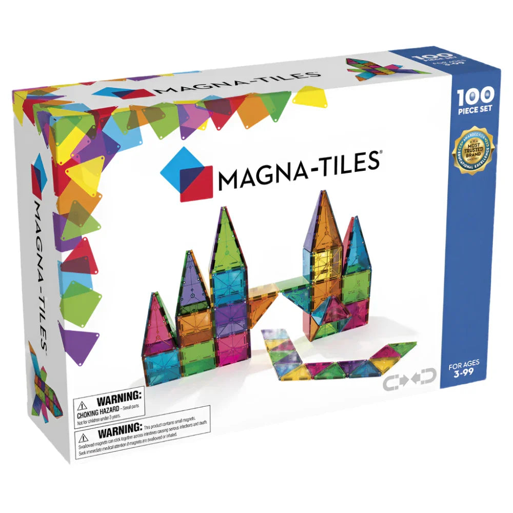 The MAGNA-TILES® Clear Colors 100-Piece Set by Magnatiles includes 100 vibrant magnetic building pieces. The set showcases structures constructed from the tiles and is suitable for ages 3 to 99, promoting creative thinking in children. Warning labels are prominently displayed on the front of the box.