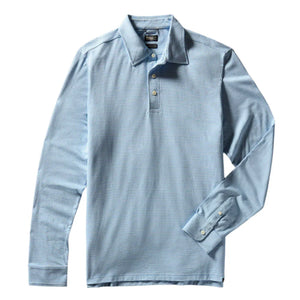 The Faherty Movement Long-Sleeve Pique Polo, in a light blue classic fit, features a collar, three buttons, and a vented hem for added comfort.