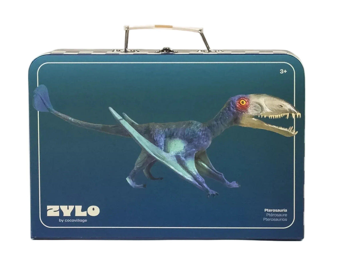 A vibrant blue illustration of a toy pterosaur adorns this blue rectangular suitcase with a handle, designed for young explorers ready for prehistoric adventures. The brand “Coco Village” and the product name “Pterosauria Dinosaur in a Collectible Box” appear in the bottom left corner, making this case an exciting addition to any dinosaur figures collection.