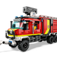 A LEGO® City Fire Command Truck by Legos - Toyhouse, showcasing a red and yellow design with building blocks, a water hose attachment, and emergency lights on top. This toy fire engine also comes with an interactive building guide for endless adventure.