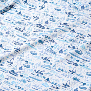 Joy Street Boys' Boats Two Piece Pajamas feature a hand-drawn nautical print with blue boats, ships, sailors, and labeled maritime terms on a white background.