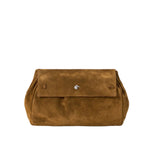 The Staud Cy Convertible Bag is a brown suede clutch with a flap closure and a small silver clasp at the center; this versatile piece can also be styled as a crossbody bag for added convenience.