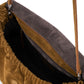 Close-up view of an open Staud Cy Convertible Bag in brown suede with a single strap, revealing the inner lining and spacious interior. This versatile piece effortlessly transitions from a chic crossbody to an elegant handheld accessory, making it ideal for any occasion.
