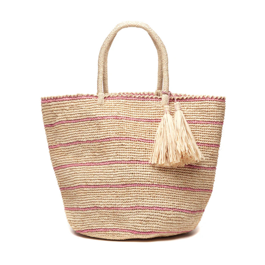 The Mar Y Sol Costa Tote features woven straw, two handles, subtle pink stripes, and beige tassel accents. Stylish and spacious, it’s ideal for carrying all your summer essentials.