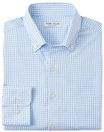 Peter Millar's Hanford Performance Twill Sport Shirt features a folded design in blue and white checkered pattern with a collar and visible label, crafted from moisture-wicking performance fabric.