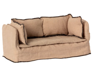 The Maileg Couch, Miniature is a small beige linen sofa with dark trim and three matching cushions, ideal for any Maileg dollhouse.