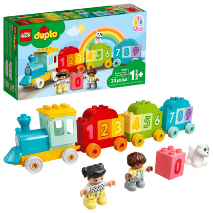 The LEGO® DUPLO® Number Train - Learn To Count is a colorful train with blocks 0–9, two child figures, a white dog, and packaging showing this fun toddler educational toy with a cheerful rainbow illustration.
