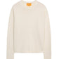 The Cozy Crew Cashmere Sweater by Guest in Residence features long sleeves, an off-white knit design, a cozy crew neckline, and ribbed neck trim, displayed on a white background.
