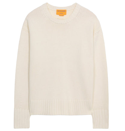 The Cozy Crew Cashmere Sweater by Guest in Residence features long sleeves, an off-white knit design, a cozy crew neckline, and ribbed neck trim, displayed on a white background.