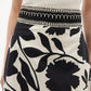 A close-up of the Figue Cressida Skirt showcasing its elegant beaded waistband.