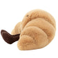 The Jellycat Amuseables Croissant, Small is a plush toy with a soft texture, featuring charming pastry knobbles and playful brown corduroy legs.