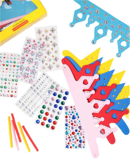 The Super Smalls Everyday Royalty DIY Crown & Tiara Kit includes colorful foam crowns, gem and letter sticker sheets, and pipe cleaners—everything kids need for a creative crafting activity.