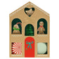 The Gingerbread Cupcake Kit by Meri Meri features a gingerbread house-shaped box with a cupcake kit inside, including gingerbread, festive toppers, peppermint decorations, a green paper tree, and a charming red door.