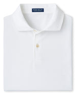 A neatly folded Albatross Cotton-Blend Piqué Polo by Peter Millar in white, featuring a collar, two buttons, soft cotton-blend fabric, and a navy blue Peter Millar label at the neck.