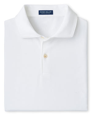 A neatly folded Albatross Cotton-Blend Piqué Polo by Peter Millar in white, featuring a collar, two buttons, soft cotton-blend fabric, and a navy blue Peter Millar label at the neck.