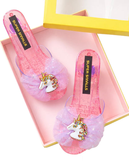 Unicorn Wishes Playshoes by Super Smalls: pink, glittery children's sandals with unicorn decorations—ideal for dress-up or play. Comes in a box with yellow edges.