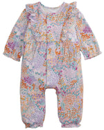 The Magnetic Me Baby Girls’ Arabella Ruffle Romper features long sleeves, ruffled shoulders, a pastel floral print, and easy diaper changes in pink, purple, orange, and green.