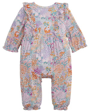 The Baby Girls’ Arabella Ruffle Romper by Magnetic Me features long sleeves, ruffled shoulders, and a pastel floral print—designed for easy diaper changes.