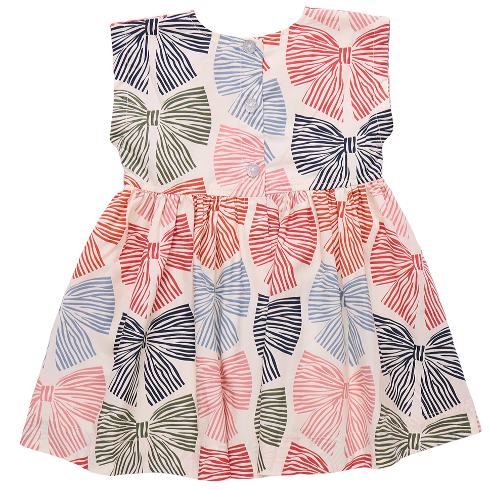 The Pink Chicken Girls' Adaline Dress features a sleeveless design with a gathered waist and large multicolored striped bows on a white background—a playful favorite for stylish little ones.