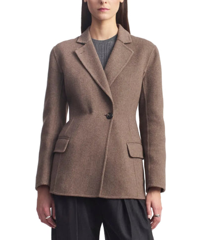 A brown virgin wool Sablier Scarf Blazer with a single-button closure, notch lapel, and two flap pockets, worn over a gray shirt.