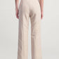 Back view of Kallmeyer Nadja Trousers in beige, high-waisted wool gazar with straight legs, a pressed crease, and a cropped ankle length.