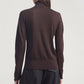 A person wearing the Kallmeyer Leona Silk Wool Cardigan—a long-sleeve, dark brown sweater with a high funnel collar—paired with black pants, shown from the back against a plain light background.