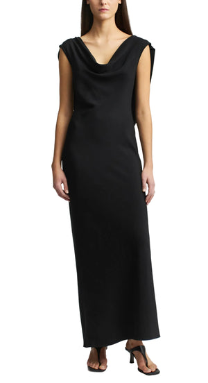 The Kallmeyer Gilda Bias Dress is a sleeveless, floor-length black viscose cady dress with a cowl neckline.