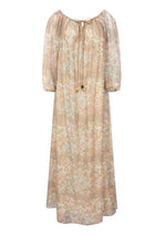 The Bonnie Maxi Jasmin Dress by Bernadette features long sleeves, an ankle-length pastel floral print, a loose fit, and a gathered neckline with tie detail—ideal for summer.