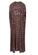 The Eleonore Polka Rain Dress by Bernadette is a long, loose brown crepe de chine dress featuring white polka rain and teardrop patterns, shown on a plain background.
