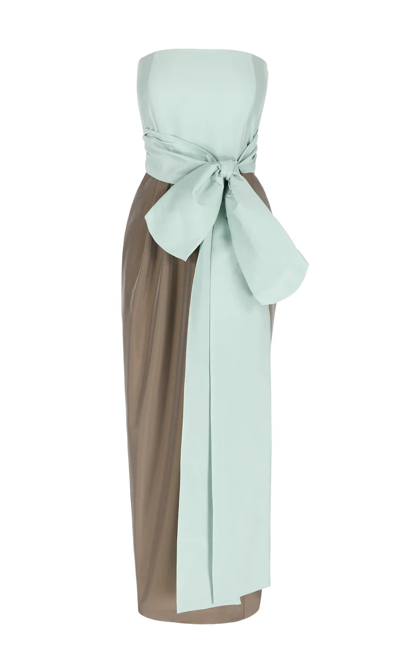 Bernadette Lina dress featuring a strapless midi design with a pale green structured bustier, an oversized taffeta bow, and a solid brown skirt.