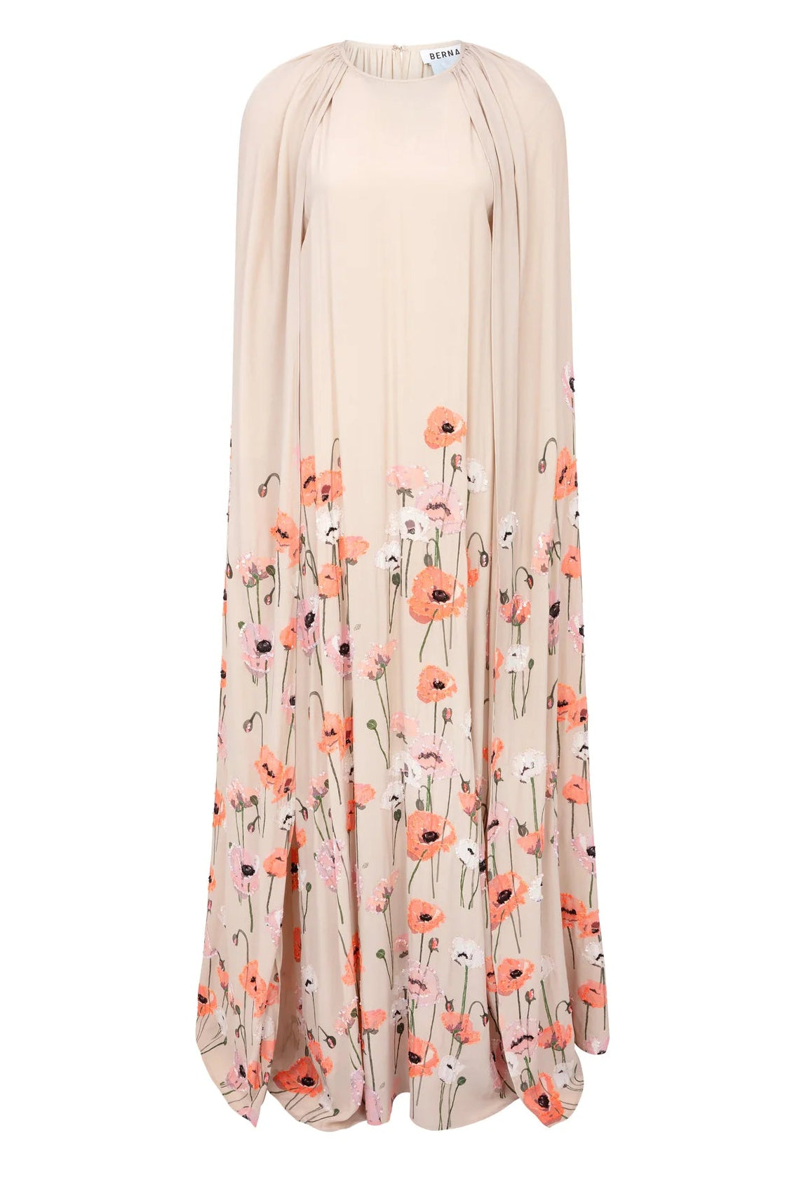 The Minnie Poppies Dress by Bernadette is a long beige cape gown featuring a high neckline, flowing silhouette, and red, pink, and white floral print along the lower half and hem.
