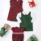 Three wrapped gifts and three children's holiday outfits—including The Beaufort Bonnet Company Girls' Darcy Dress, a green romper with white shirt, and a red plaid baby romper—are arranged on a white background.