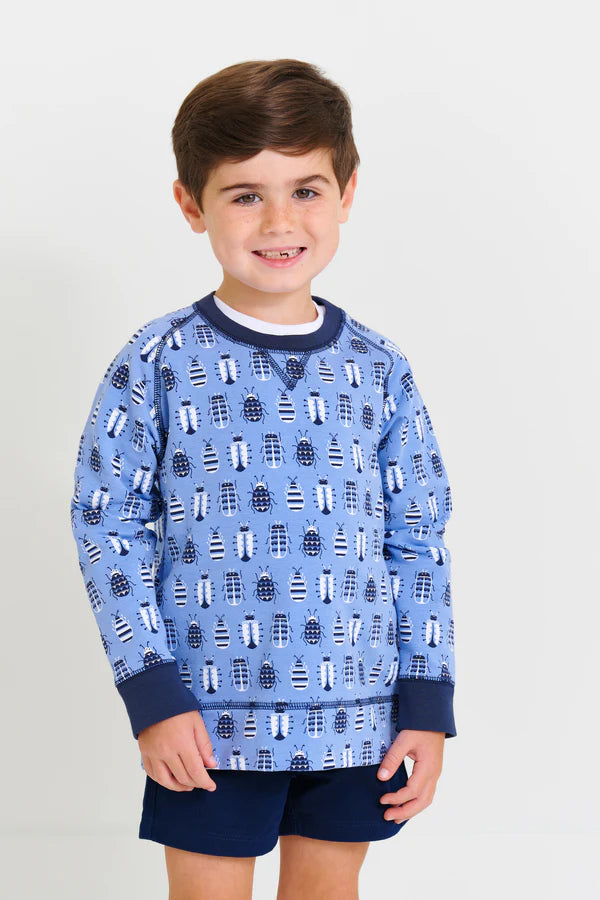 A young boy with brown hair wears a light blue lighthouse shirt and Boys' Sheffield Shorts from The Beaufort Bonnet Company, standing against a white background.