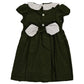 The Kidiwi Daria Smocked Dress is a delightful dark green toddler outfit made from cotton corduroy, boasting a white Peter Pan collar, hand-embroidered neckline, a white bow at the waist, and buttons down the front.