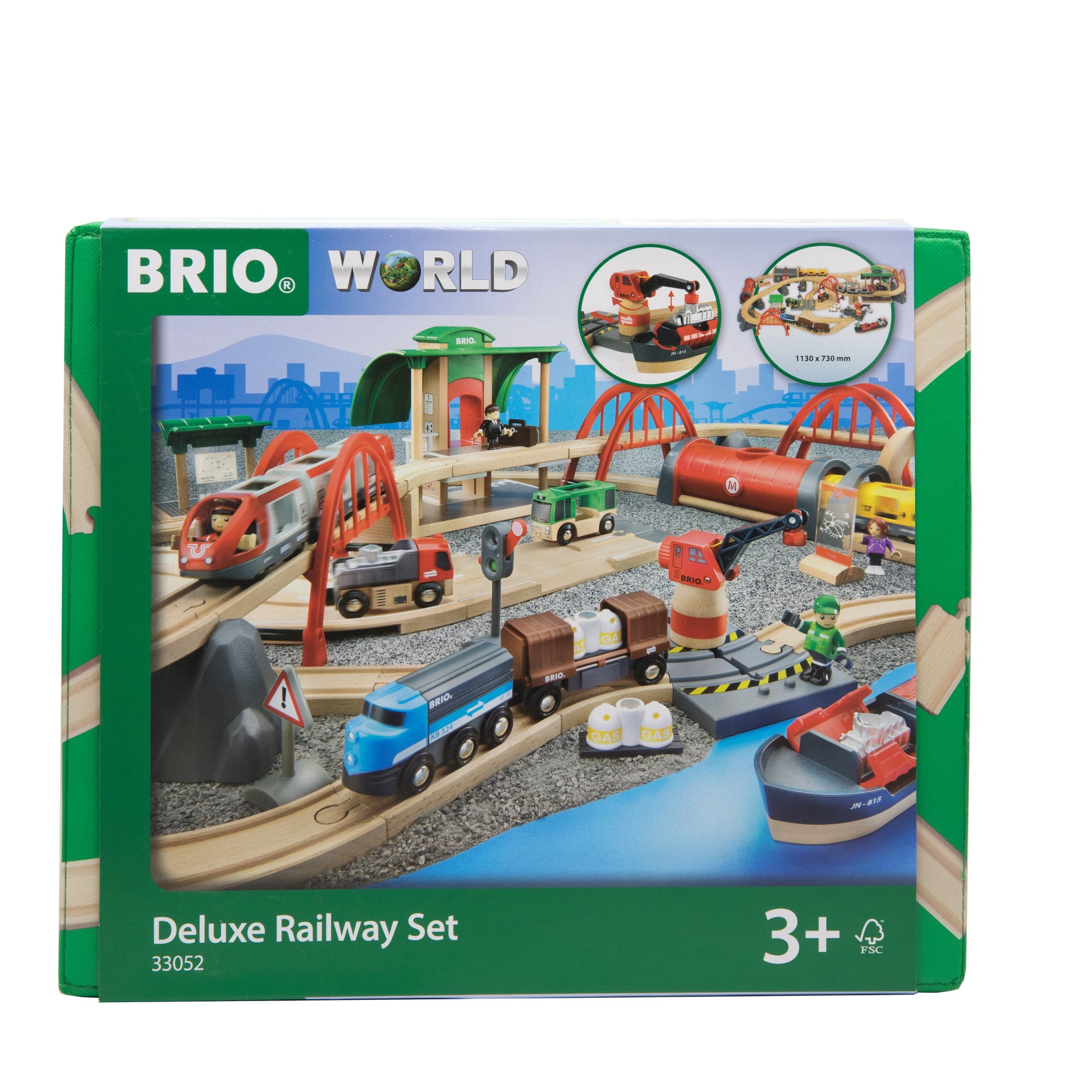 A Brio World Deluxe Railway Set box showcasing a detailed toy train set complete with tracks, bridges, trains, and vehicles. The green packaging emphasizes the BRIO Rail & Road system and is recommended for ages 3 and up.