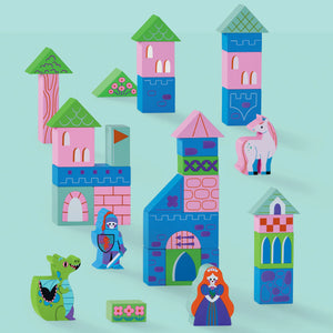 The Crocodile Creek Build & Play Wood Blocks Princess Palace set includes colorful wooden blocks to create a castle with towers, a knight, princess, unicorn, dragon, and greenery on a light blue background.