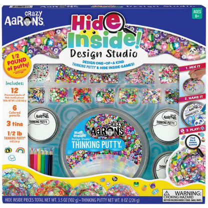 The Crazy Aarons Hide Inside Design Studio Kit by Crazy Aarons is a Thinking Putty set featuring colorful inclusions with six tins and three vibrant colors. This entertaining and stimulating kit includes optional games for sensory integration, making it suitable for ages 8 and up. Note: contains small parts.