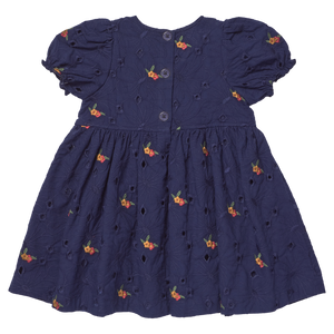 Pink Chicken Girls' Eliza Eyelet Embroidery Dress in navy features short puffed sleeves, delicate floral embroidery, eyelet details, and button closure down the back. Displayed on a plain background, this charming dress is perfect as a fall outfit for girls for any occasion.