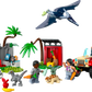 The LEGO® Jurassic World Baby Dinosaur Rescue Center includes two figures, three small dinosaurs (with a baby dino), a pterodactyl, red jeep, plants, and a small shelter with accessories for exciting dinosaur-themed play.