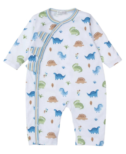 The Kissy Kissy Dinosaur Domain Playsuit is designed with long sleeves and crafted from soft Pima cotton, featuring blue and green dinosaur prints, striped accents, and a front snap closure.