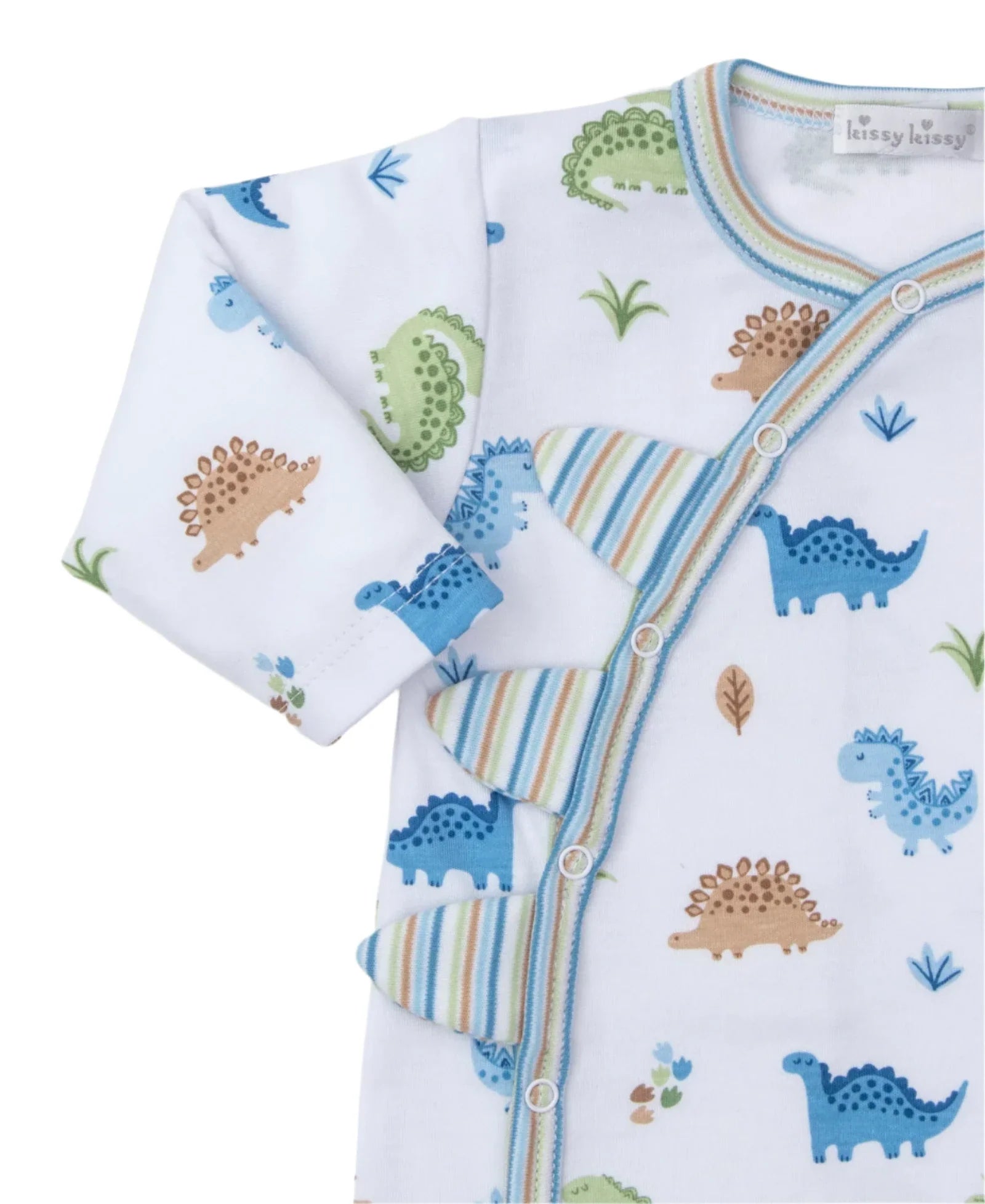 The Kissy Kissy Dinosaur Domain Playsuit, crafted from soft Pima cotton, features charming dinosaur prints in blue, green, and brown. It is adorned with striped accents and playful decorative fabric spikes along the side, adding a whimsical touch.