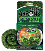 Crazy Aarons presents their Dino Scales Thinking Putty, showcasing a lively mix of green, orange, and brown non-toxic silicone putty with dinosaur-themed packaging. It's ideal for sensory integration and limitless creative enjoyment.