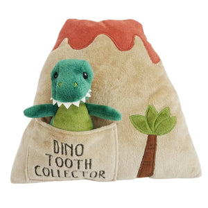 Introducing the MON AMI Dino Island Tooth Fairy Pillow Doll Set by Mon Ami: a delightful volcano-shaped pillow complete with a green dinosaur plush toy tucked into a front pocket labeled "Dino Tooth Collector." It also features a charming small palm tree design. Ideal for celebrating your child's excitement when they lose a tooth!