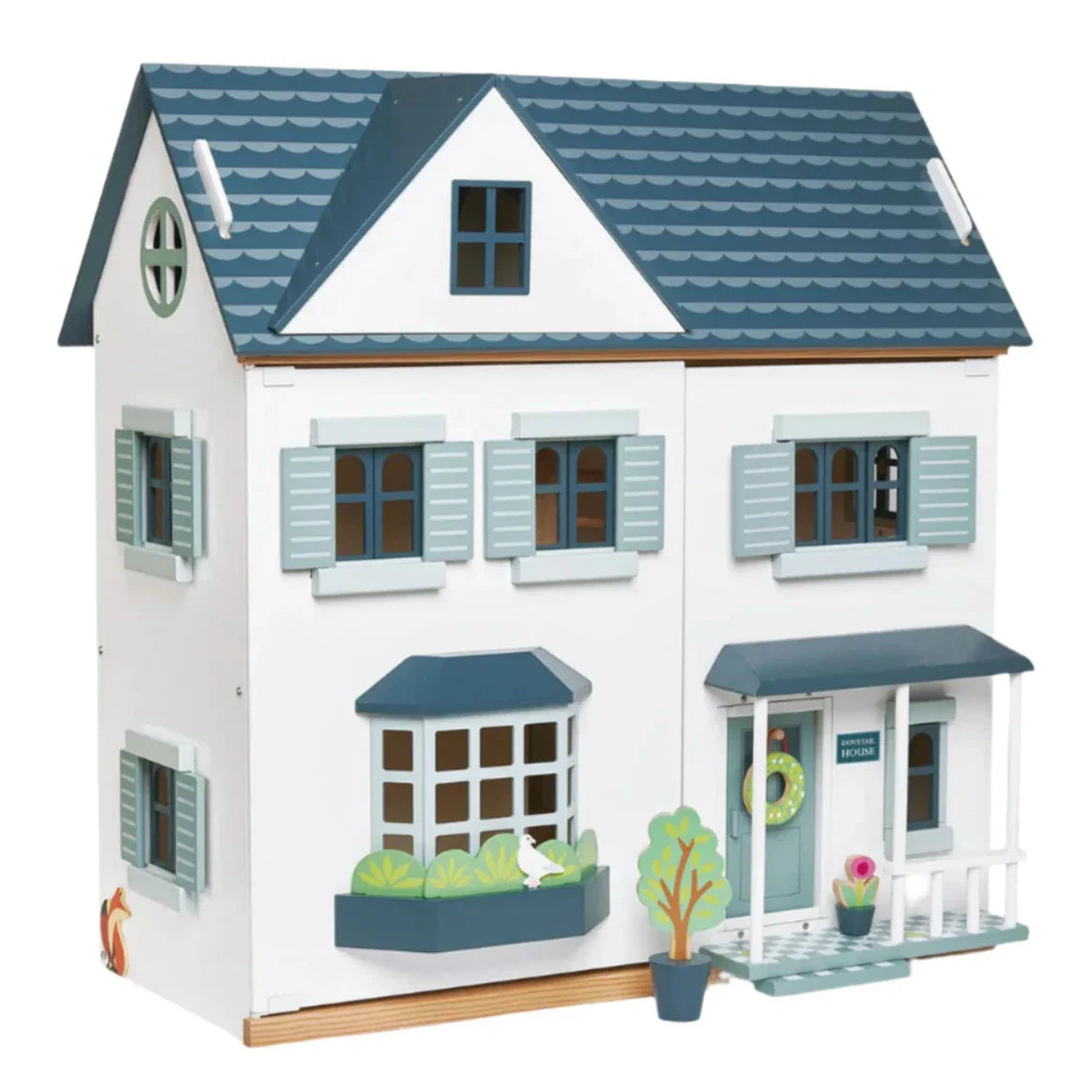 The Tender Leaf Dovetail Doll House by Tender Leaf Toys features a charming blue and white design spread over three floors, complete with dovetail furniture, shuttered windows, a bay window, a small balcony, and an inviting front porch—all in lovely gender-neutral colors.