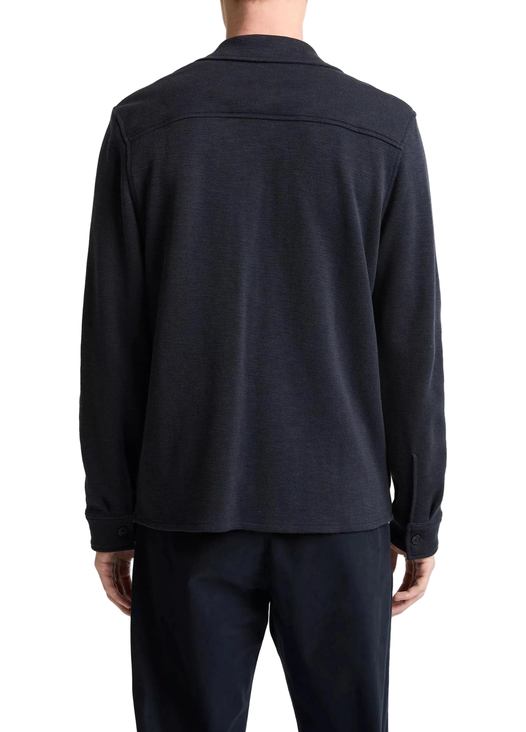 Seen from behind, a person wears dark pants and the Vince Double Slub Shirt Jacket—a collar style with buttoned cuffs, crafted from premium cotton lyocell for ultra-soft comfort.