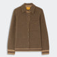 The Dylan Marquise Shirt by Guest in Residence is a brown, long-sleeve cashmere shirt featuring a geometric diamond pattern, front buttons, a chest pocket, and a collar in a relaxed fit, shown against a plain background.
