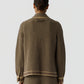 A person is seen from behind wearing a matching brown and beige geometric patterned jacket and relaxed fit pants, paired with the Dylan Marquise Shirt from Guest in Residence, standing against a plain light gray background.